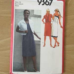 May include: Simplicity sewing pattern number 9367 for a dress with a cropped jacket. The pattern is for a size 10 with a bust measurement of 83 cm. The pattern shows three different styles of the dress.