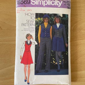 May include: Simplicity sewing pattern number 6569 for a miss size 12 with a bust measurement of 87 cm. The pattern includes instructions on how to sew a vest and skirt. The image shows three women wearing different versions of the pattern. One woman is wearing a red skirt and vest, another is wearing a blue skirt and vest, and the third is wearing a plaid skirt and vest.