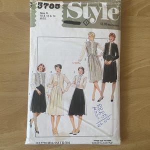 May include: A sewing pattern for a skirt and vest. The pattern is for sizes 10, 12, and 14. The pattern is called "Style" and the number is 3783.
