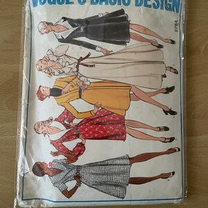 May include: A vintage Vogue Basic Design sewing pattern featuring five different dress designs. The pattern number is 2764.