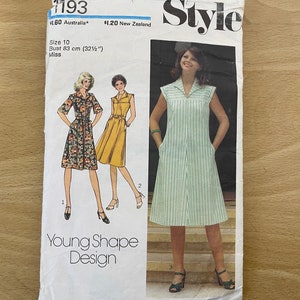 May include: A vintage "Style" sewing pattern featuring dress designs. The pattern is size 10, with a bust measurement of 83 cm. The design is labeled "Young Shape Design".