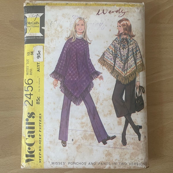 McCall’s 2456 vintage 70s poncho with laced front, shoulder darts, braid, button and loop closing or fringe plus narrow pants sewing pattern