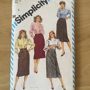 May include: Vintage Simplicity sewing pattern, size 14 Miss, featuring illustrations of women's skirts and blouses. The pattern cover has a white background with blue stripes and the Simplicity logo.