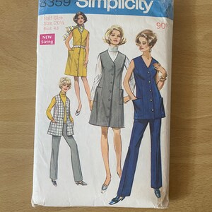 May include: Simplicity sewing pattern number 8359 for a sleeveless dress with a button-up front and pockets. The pattern includes three different styles: a yellow dress, a gray dress, and a blue dress with matching pants. The pattern is for a half size, size 20 1/2, bust 43. The pattern is new sizing and costs 90 cents.