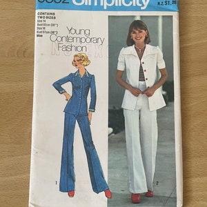 May include: Simplicity sewing pattern number 6892 for a young contemporary fashion design. The pattern includes two sizes, 14 and 16, with bust measurements of 92 cm and 97 cm respectively. The pattern features a white blouse with a red stripe detail and a pair of white wide-leg trousers. The model is wearing red shoes.