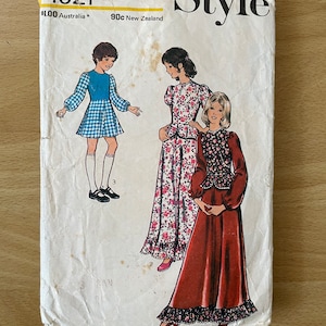 Style 4921 vintage 70s girls dress with fitted bodice, high neck, peplum, puffy sleeves and optional ruffle sewing pattern