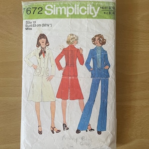 May include: Simplicity sewing pattern number 7672 for a miss size 10 with a bust measurement of 83 cm. The pattern includes three different looks: a white skirt and jacket, a red skirt and jacket, and a blue pantsuit. The pattern is for a navy blue gabardine.