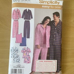 May include: Simplicity sewing pattern 3971 for pajamas. The pattern includes options for long and short sleeve tops, pants, and shorts. The package features images of the finished garments and includes a fire warning.