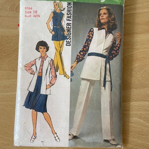 May include: Simplicity pattern number 9304, Designer Fashion, for a sleeveless top and pants. The pattern is for a size 10, bust 32 1/2 inches.
