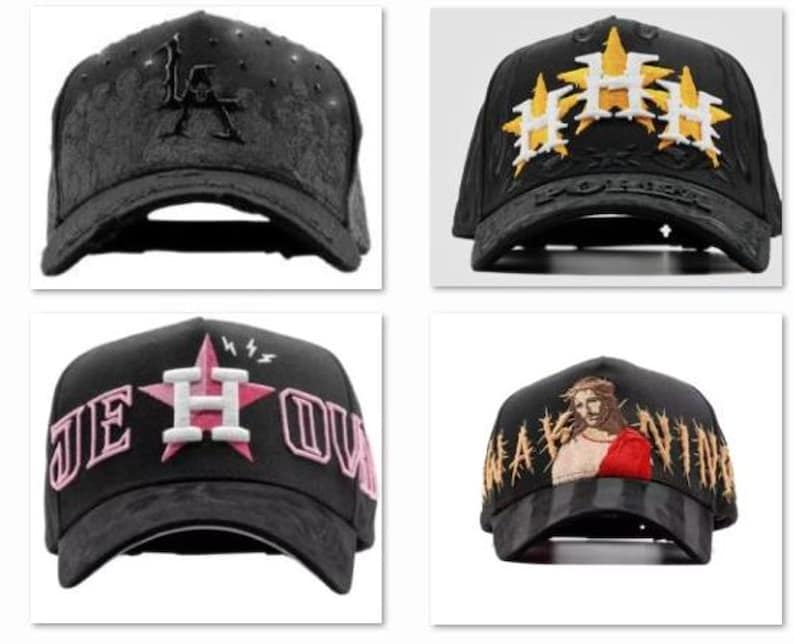 May include: Four black baseball caps with embroidered designs. One features the letters "LA", another has gold and white starbursts, a third displays "JE HOU", and the last depicts a religious figure.