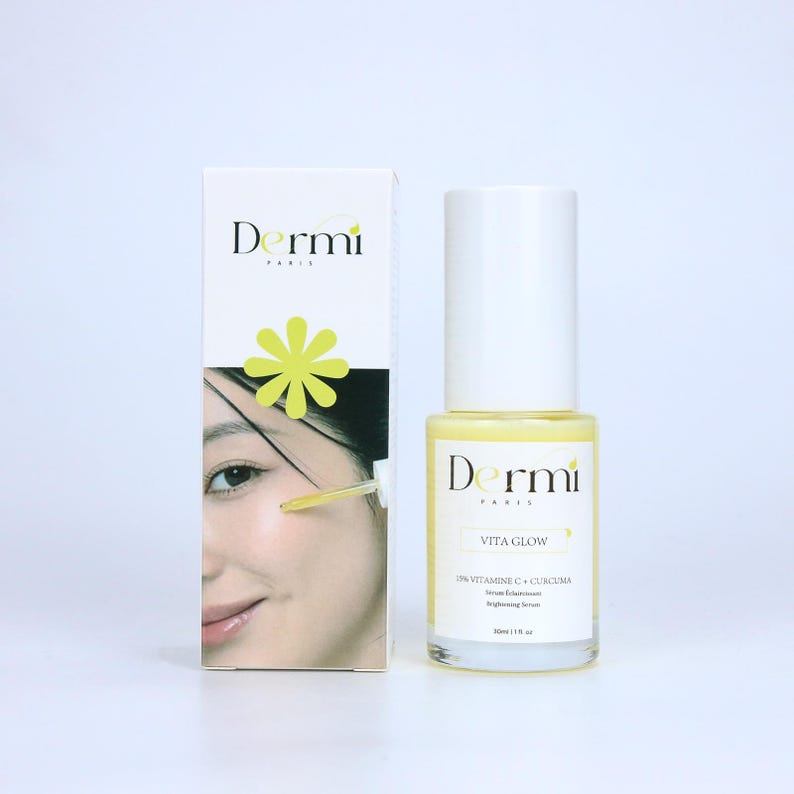 May include: A white rectangular box and a clear glass bottle of Dermi Paris Vita Glow brightening serum. The box features the brand name, a yellow flower icon, and a photo of a face with a dropper. The bottle has a white cap and yellow liquid.