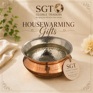 May include: A round, hammered metal bowl with a copper-colored exterior and a silver-colored interior. A circular paper tag attached with twine reads SGT GLOBLE TRADERS Bringing the World to Your Home. The text SGT GLOBLE TRADERS HOUSEWARMING Gifts appears above.