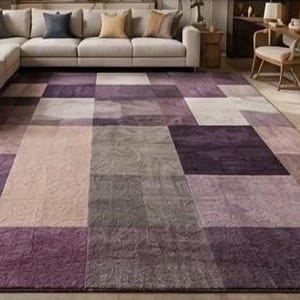 May include: A large rectangular area rug featuring a geometric pattern of alternating squares and rectangles in various shades of purple, mauve, light pink, and cream. The rug has a textured surface and covers a significant portion of the floor.