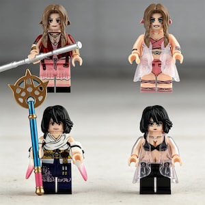 May include: Four Lego-style figurines of female characters. Each figure has a unique outfit and hairstyle. One figure holds a staff with a gold and blue design. The other figures have pink, black, and white outfits.