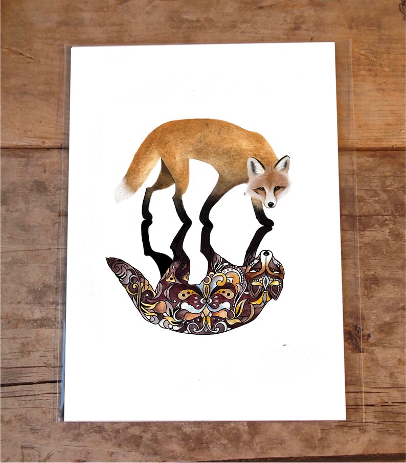 May include: A watercolor illustration of a fox standing on top of a patterned, stylized fox. The fox is orange and brown, and the patterned fox is brown, black, and gold.