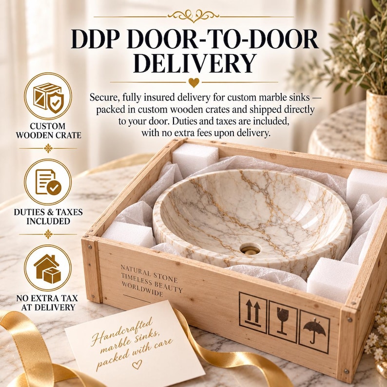 May include: A round marble sink with beige and brown veining, nestled inside a light-colored wooden shipping crate with white foam padding. The crate features text reading Natural Stone Timeless Beauty Worldwide and includes shipping icons.