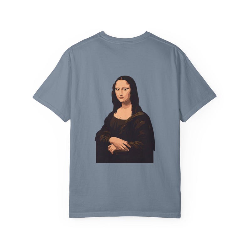 The back of a slate blue t-shirt displays a graphic of the Mona Lisa portrait.