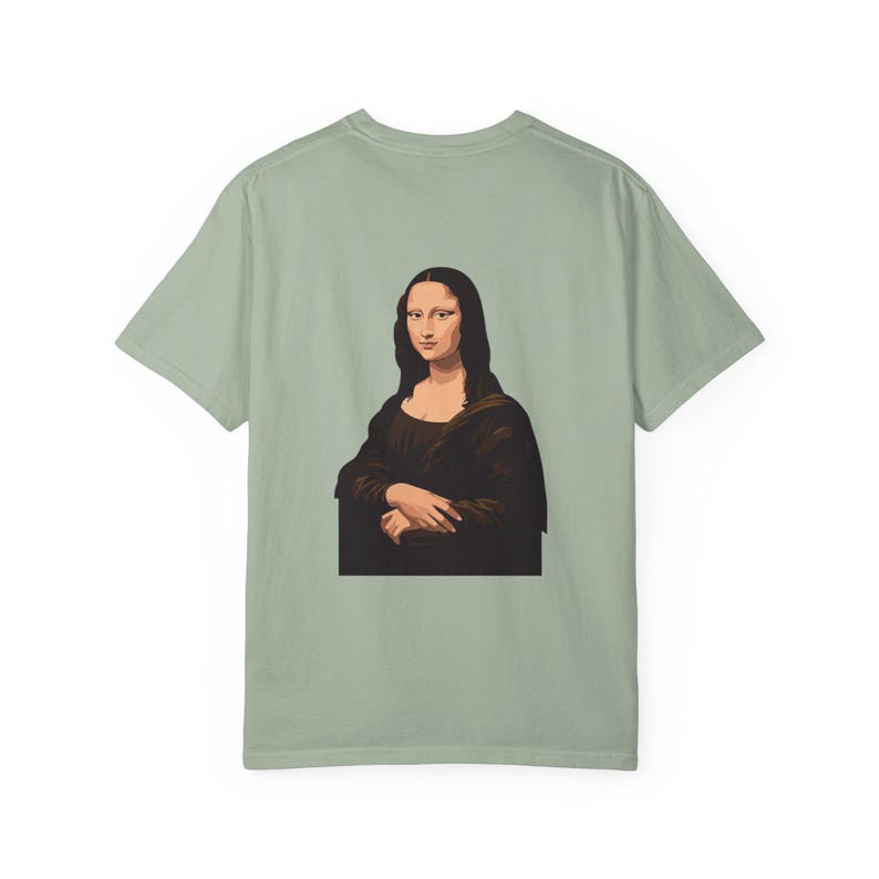 The back of a light green t-shirt shows a graphic of the Mona Lisa portrait.
