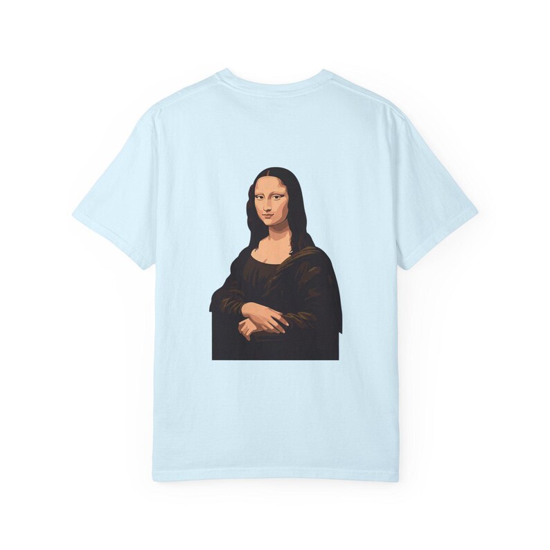 The back of a light blue t-shirt features a graphic of the Mona Lisa portrait.