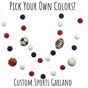May include: A sports garland with felt balls in red, white and blue. The garland features felt balls with images of a baseball, basketball, football and soccer ball. The garland says "Pick Your Own Colors!" and "Custom Sports Garland".