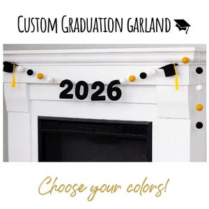 May include: A custom graduation garland with the year 2026 in black felt letters. The garland includes black, white, and gold felt balls, and miniature graduation caps. The text "Custom Graduation Garland" and "Choose your colors!" are also visible.