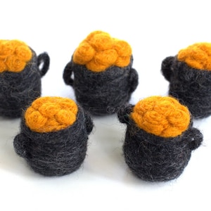 May include: Five small felt pots filled with gold coins. The pots are gray and the coins are yellow.