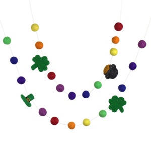 May include: A rainbow felt ball garland with shamrock, pot of gold, and leprechaun hat charms.