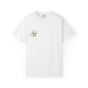 May include: White t-shirt featuring a small, cartoon alien with a bow tie giving a thumbs up. The alien is light green with black eyes and antennae. The t-shirt has a crew neck and short sleeves.