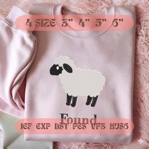 May include: A light pink sweatshirt featuring an embroidered white sheep with a black face and legs. Below the sheep is the text "Found". The image includes text indicating 4 sizes: 3", 4", 5", and 6", along with file formats JEF, EXP, DST, PES, VP3, and HUS6.
