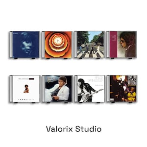 Peut inclure: Huit pochettes d'albums encadrées, dont Stevie Wonder, The Beatles et Bruce Springsteen. Les pochettes présentent une variété de couleurs et de styles, des portraits aux motifs abstraits. Le texte "Valorix Studio" est en bas.