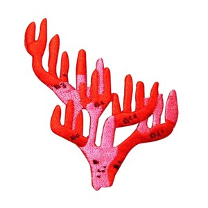 May include: Red and pink coral-shaped patch with a textured fabric design.