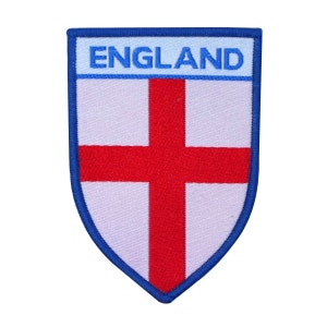 May include: An embroidered patch featuring the English flag, with a red cross on a white background and the word "ENGLAND" in blue lettering.