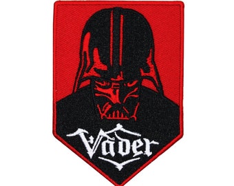 May include: A red and black embroidered patch featuring Darth Vader's helmet and the word "Vader" in white lettering.