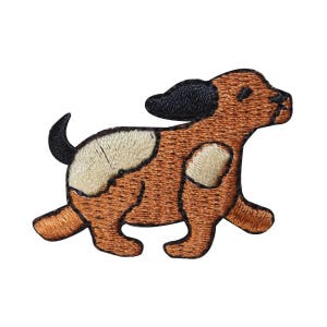 May include: Embroidered iron-on patch of a brown and white dog with black ears, running to the right.