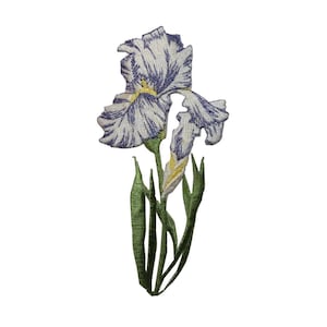 May include: An embroidered iron-on patch featuring a purple and white iris flower with green stems and leaves.