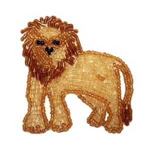May include: A brown beaded lion figurine with a detailed mane. The lion is standing on all four legs with its tail curled up behind it.