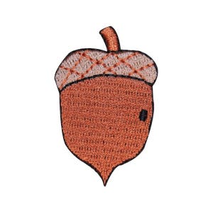May include: A brown acorn with a tan cap, embroidered with a crosshatch pattern. The acorn is a patch or applique, perfect for adding a touch of nature to crafts and projects.