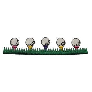 May include: Five white golf balls with black markings on green grass. Each golf ball is on a tee with a different coloured base: pink, yellow, purple, yellow, and pink.