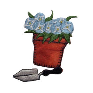 May include: An embroidered iron-on patch depicting a potted plant with blue flowers and a small trowel. The pot is orange and the trowel is silver.