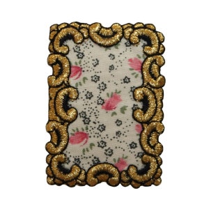 May include: A gold embroidered frame with a floral pattern on a white background. The frame is black and gold and has a decorative design.