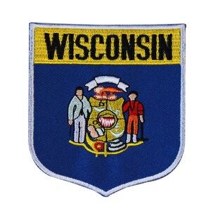 May include: A blue and yellow embroidered patch with the word "WISCONSIN" in black lettering at the top and the state seal in the center. The seal features a shield with a red bird and a blue and white banner.