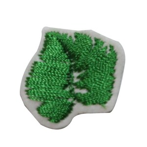 May include: Green embroidered leaf design on a white fabric patch.