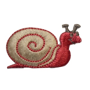 May include: A red and beige embroidered snail applique patch. The snail has a beige shell with a red spiral and a red body.