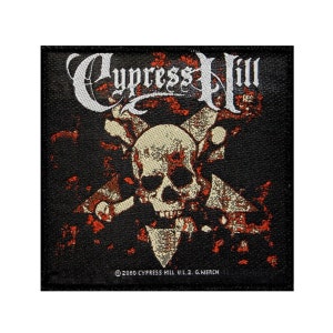 May include: Black and white embroidered patch with the band name "Cypress Hill" in white lettering. The patch features a skull with crossed bones and a red and orange splatter effect.