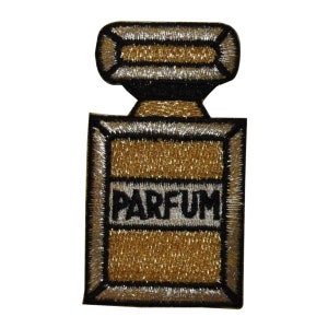 May include: Gold and silver embroidered iron-on patch of a perfume bottle with the word "PARFUM" in black lettering.