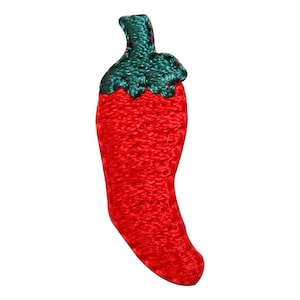May include: A red chili pepper-shaped patch with a green stem. The patch has a textured surface and is set against a white background. The chili pepper is a vibrant red color.