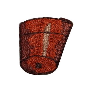May include: A brown and white embroidered patch shaped like a small barrel. The barrel has a white stripe down the centre.