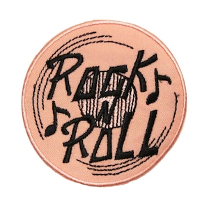 May include: A pink and black embroidered iron-on patch with the words "Rock 'n' Roll" and a stylized record.