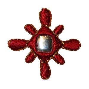 May include: A red embroidered starburst with a small, round mirror in the center. The starburst has a gold outline and is surrounded by a white background.