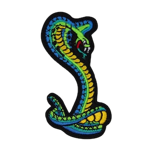 May include: Embroidered patch featuring a stylized cobra in vibrant colors. The snake is depicted in shades of green, blue, and yellow, with a red tongue and white fangs. The patch has a black border and is designed for application on clothing or accessories.